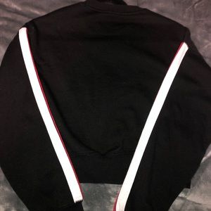 Sweater with stripes on the sleeves